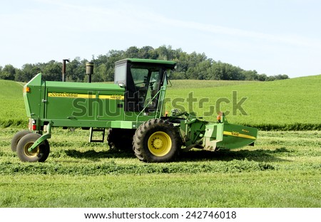 SPENCER , WISCONSIN,August,9,2014 ,  John Deere 4995 Self Propelled Windrower. John Deere is an American agricultural equipment manufacturer founded in 1837