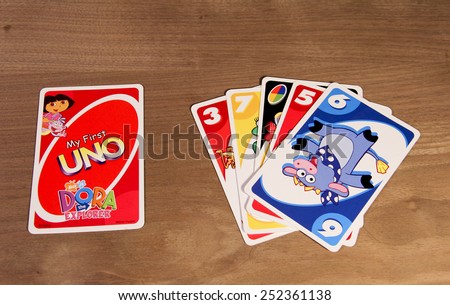 SPENCER , WISCONSIN,  February, 03, 2015   Dora the Explorer UNO cards from the game showing front and back of cards. UNO is an American card game founded and invented in 1971
