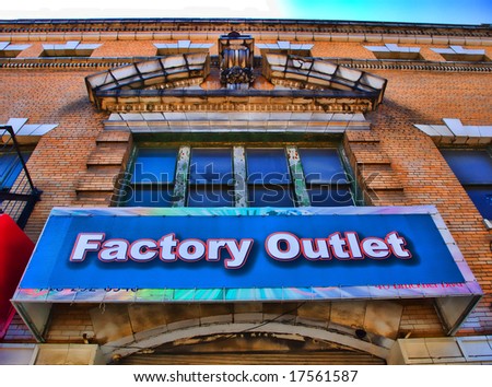 View of sign on a factory outlet residing within an historic and beautiful building.