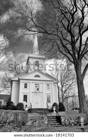 Black and white image of classic style New England church.