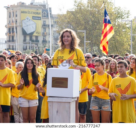 BARCELONA, SPAIN - SEPT. 11: Emma Sole whose 16th anniversary is in November 9 deposits a symbolic vote in the rally for the independence on Sept.11, 2014 in Barcelona, Spain.