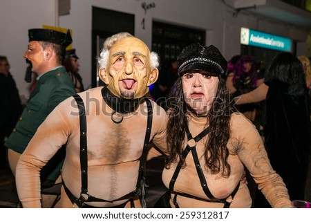 SITGES, SPAIN - FEBRUARY 15, 2015: Sitges Carnival\'s Carnestoltes, a couple in a vicious old-couple costume during the Disbauxa \'Parade\' celebrated on February 15, 2015 in Sitges, Spain.