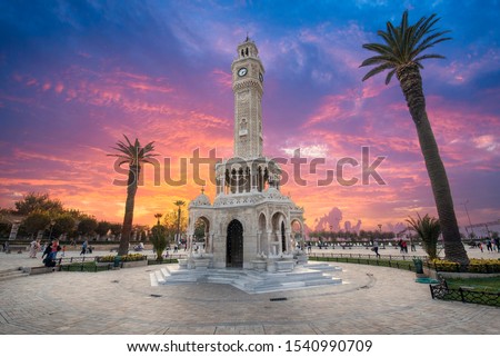 Konak Square street view with old clock tower (Saat Kulesi) at sunset. It was built in 1901 and accepted as the official symbol of Izmir City, Turkey.  Imagine de stoc © 
