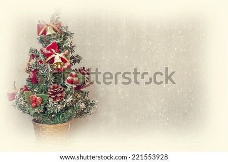 small christmas tree with snowfall background and white border