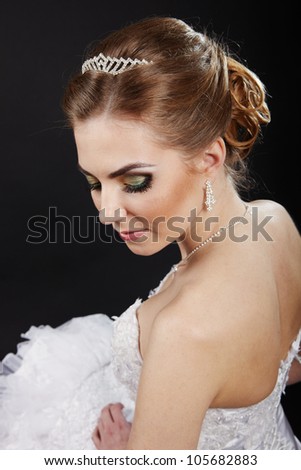 Closeup picture of a bridal hairstyle on a dark background