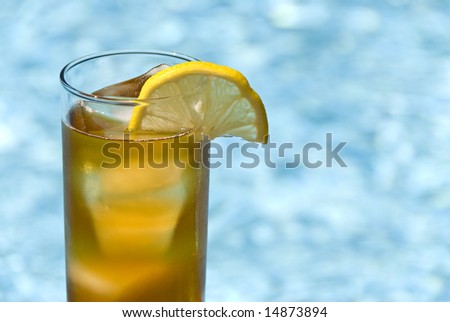 Tall Glass of Ice Tea by the Swimming Pool