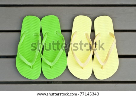 Two Pair of Flip Flops on the Deck