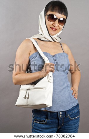 Asian Woman Wearing Silk Scarf, Sunglasses, and Carrying a White Leather Purse