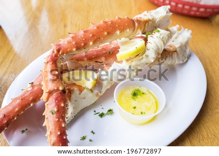 Alaskan King Crab Legs Served with Butter and Lemon Slices