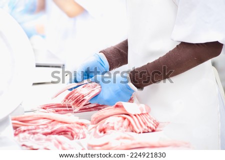 butcher packing pork in meat industry