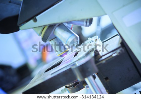 close up of microscope lens in laboratory hospital