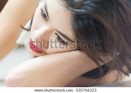 close up Asia women face lying on floor, beauty concept