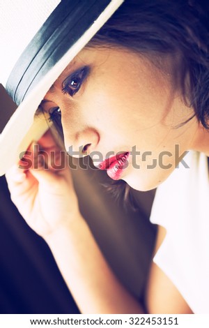 head shot of asia woman with hat in room, beauty concept, vintage effect