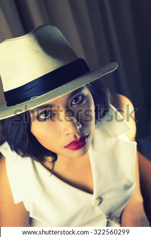 head shot of asia woman with hat in room, beauty concept , vintage style