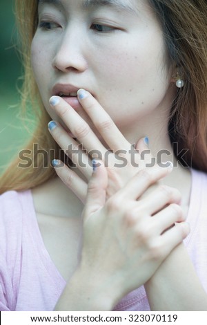 close-up of beautiful face women and manicured fingers