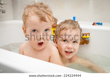 Portrait of cute baby in bath