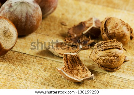 Dried hazelnuts on a chop board