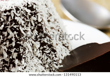 Chocolate pudding with coconut and a piece of chocolate