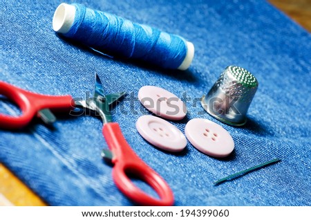 Tools for sewing and handmade: thread, scissors, buttons,pins.