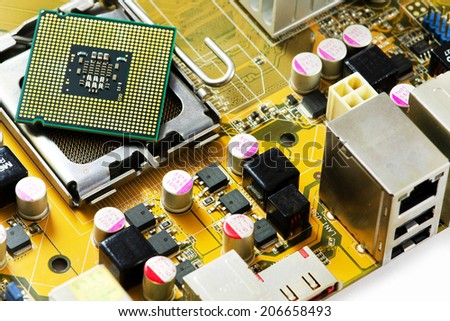 Image of a motherboard with CPU socket, heatsink and electrical components.