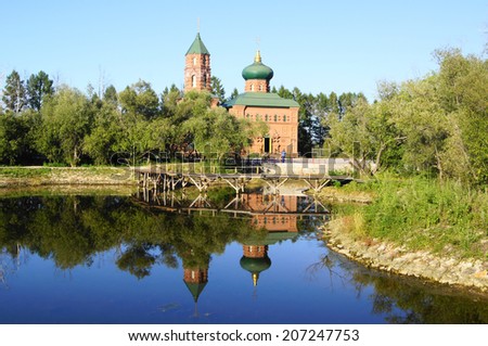 Building of church in pseudo-russian style on the the shore of the pond. Park of Chinese and Russian national traditions near the city of Heihe (Heilongjiang Province, Peoples Republic of China).