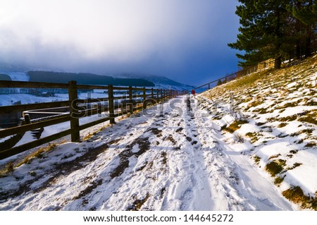 Snow covered walkway in Dove stone Reservoir Peak district North west England, where people come for walk, run and cycling. Image no 26.