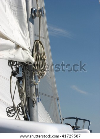 full rigging on mast of sailboat in full sail