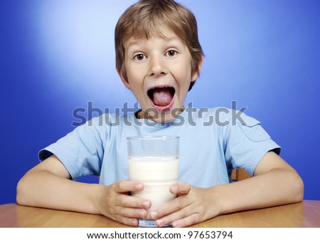 happy boy with glass of milk