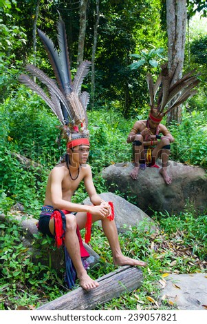 BORNEO ISLAND - MALAYSIA OCTOBER, 18:Malaysian aborigines in national costumes, october 18, 2014, Borneo island, Malaysia.