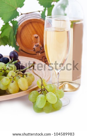 White wine bottle, glass and cask with grapes over white
