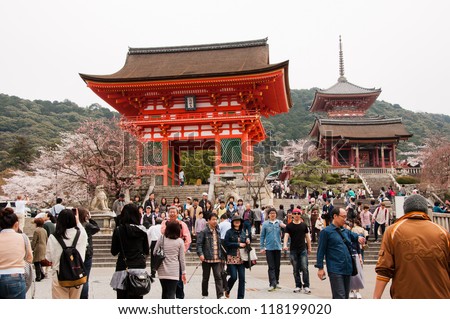 KYOTO, JAPAN - APRIL 10 2012: Tourists visit Koyomizu temple, a famous tourist attraction, in Kyoto on April 10 2012 for sakura viewing. The temple was built in year 778 without using any nails.