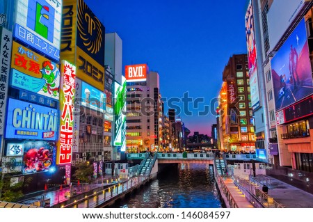 OSAKA, JAPAN - APRIL 6 : Japanese people wander in Dotonbori area of Osaka after work on April 6 2012. Dotonbori is an entertainment area of Osaka famous for its neon signs.
