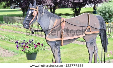 Wooden horse in the garden