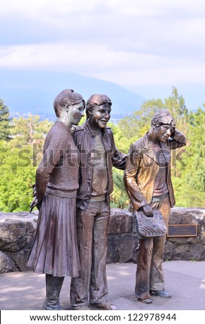 VANCOUVER BC, JUNE 15: The tourists statues in Queen Elizabeth park are bronze art treasures for Vancouver BC. They act like a magnet for tourists to take pictures on June 15, 2012 in Vancouver.