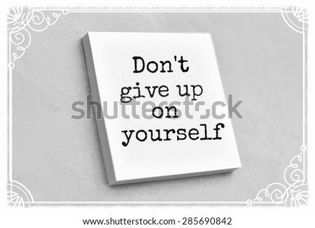Vintage style text don\'t give up on yourself on the short note texture background