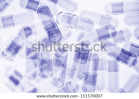 empty blue toned capsule for medicine background