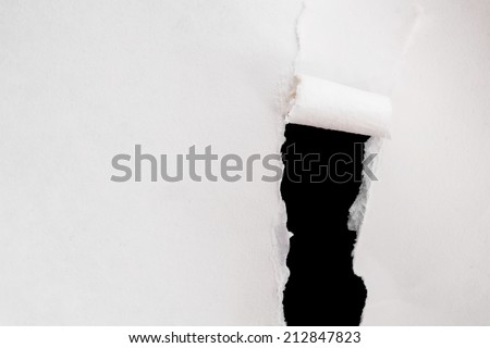 white paper torn off on black background