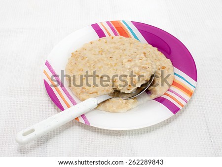 Useful  porridge for breakfast in a beautiful bright  platter.
