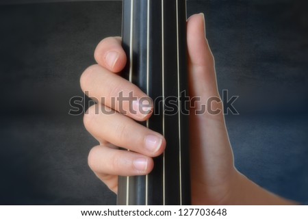 Hand playing stringed instrument