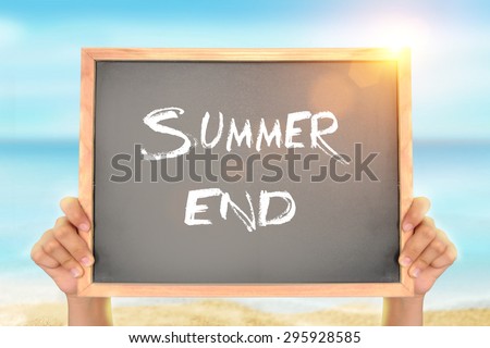 Blackboard with Summer End text on the Beach