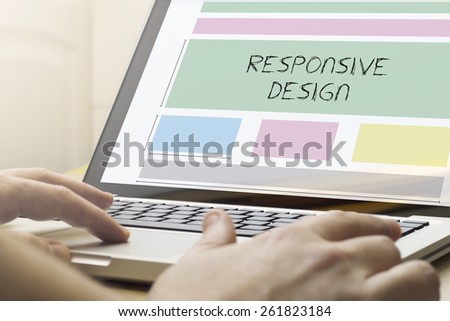 responsive design concept: man using a laptop with responsive wireframe