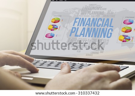 economy and market concept: man using a laptop with financial planningon the screen. Screen graphics are made up.