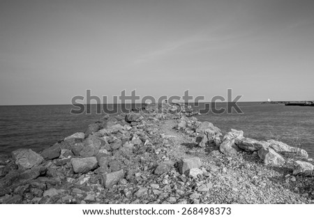 Stone pier at Thailand sea black and white