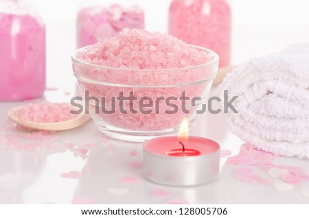 Beautiful pink spa setting with candle