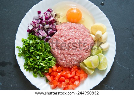 Raw Minced Meat With Vegetables For Homemade Meat Patty (Kabab, Kebab) On Black Chalkboard