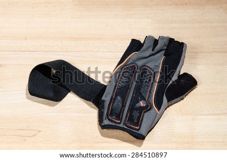 old fitness glove on wooden background