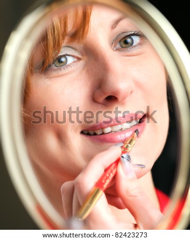 woman looking into a mirror