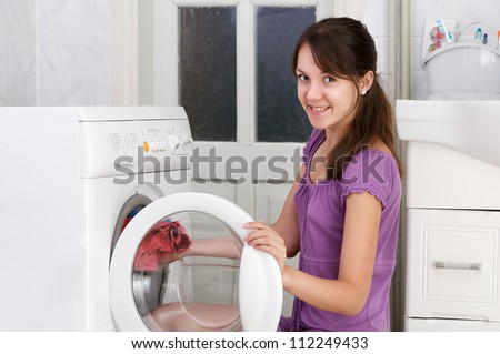 The beautiful girl is washing clothes