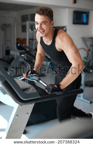 athlete exercising on a stationary bike  in the gym
