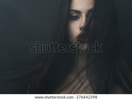 mysterious portrait of a girl in the dark, in the fog